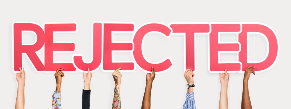 hands holding rejected letters for solar PTO