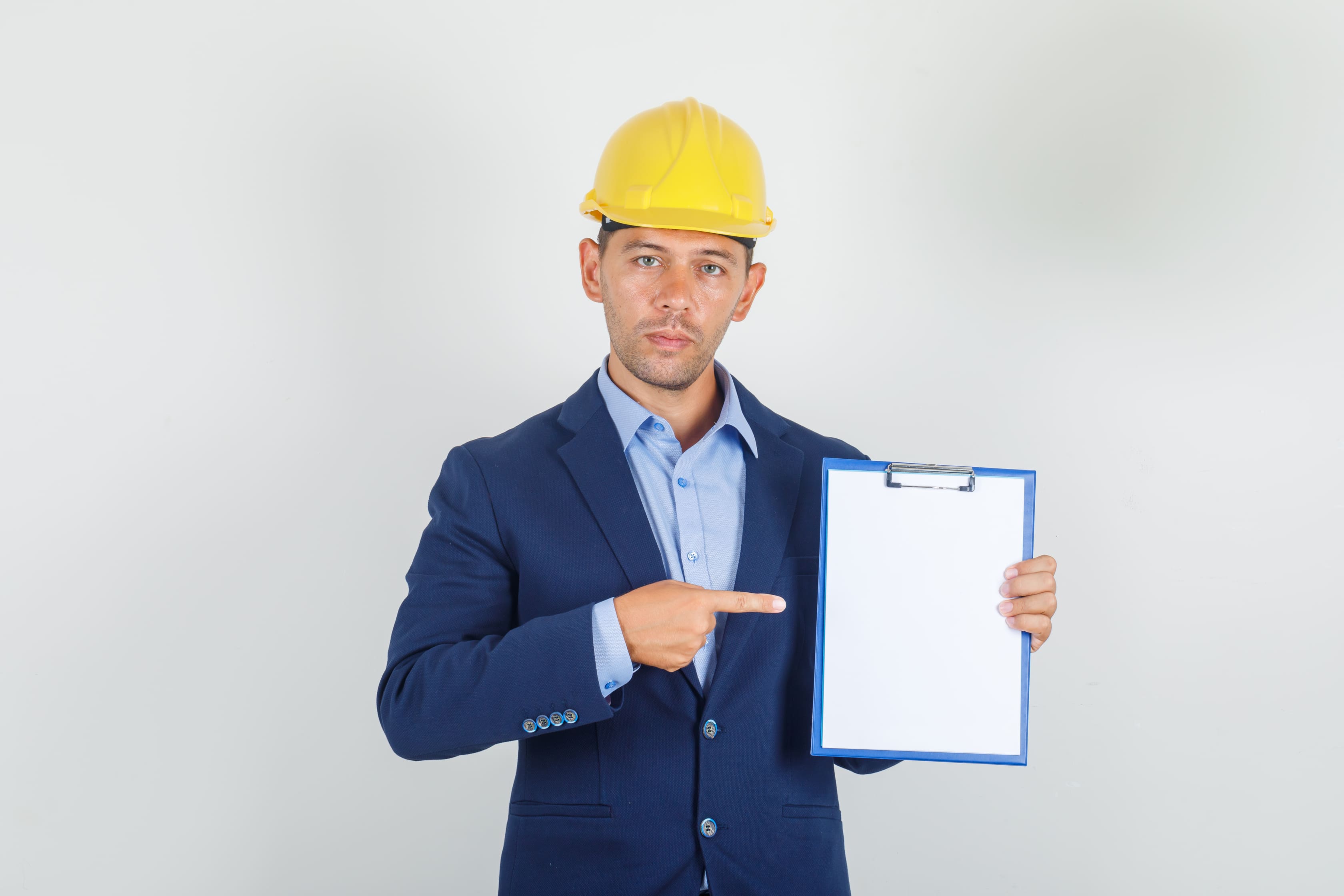 Man points to blank clipboard for contract signing