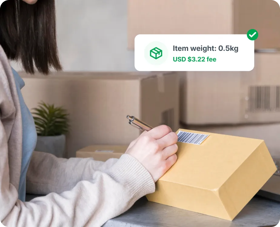 A woman writing in a box with a Dialog box showing the item's weight