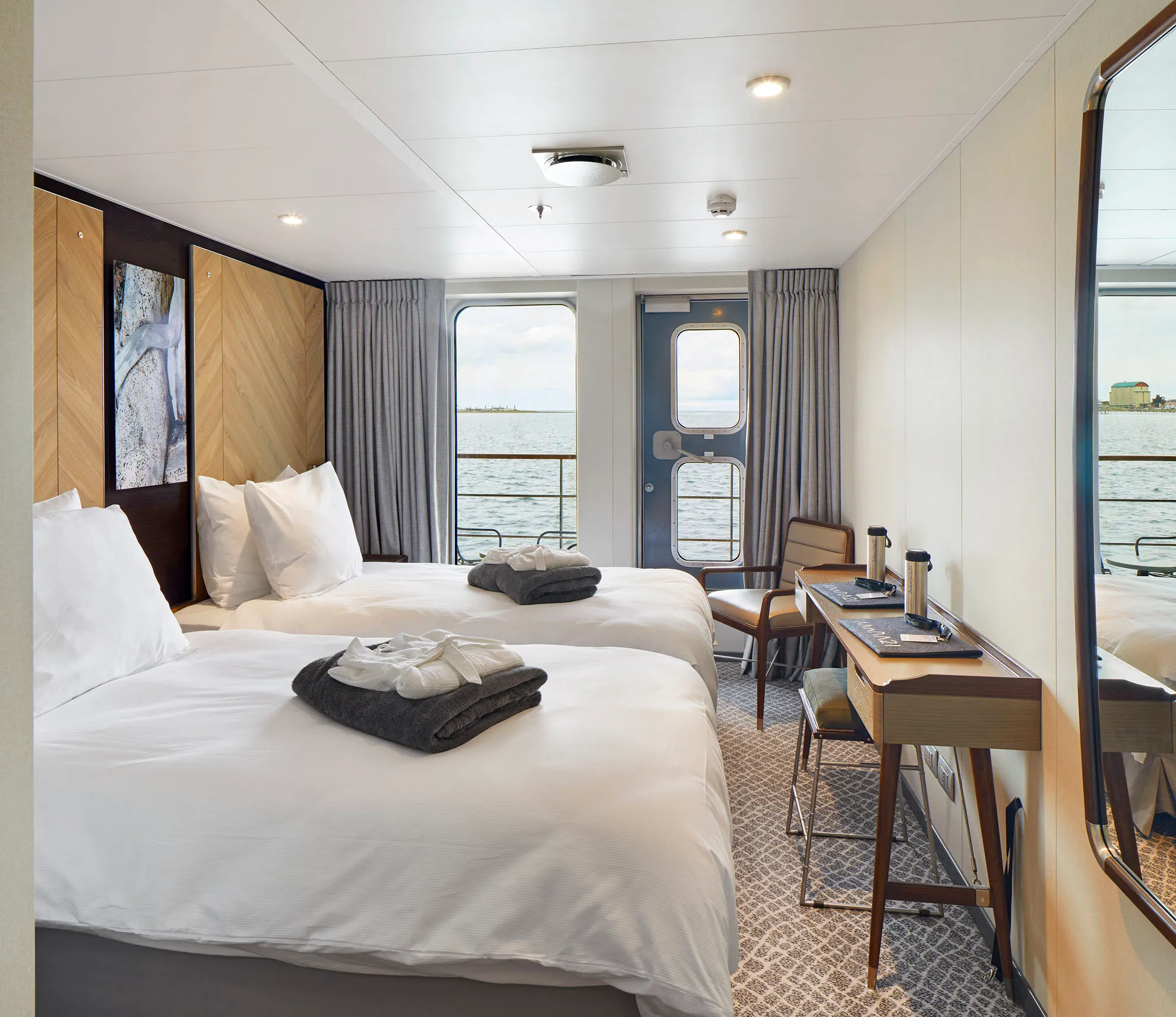 Veranda Cabin with twin beds onboard Antarctica21's Magellan Explorer in Antarctica