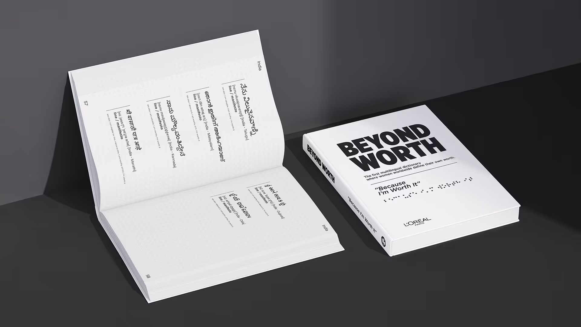 Closed and open books titled Beyond Worth, a multilingual dictionary where women worldwide define their own worth, featuring text and Braille.