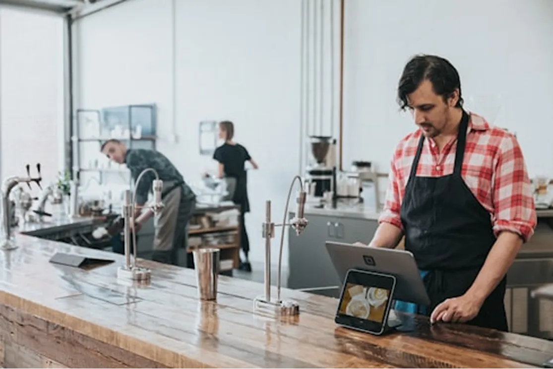 A business owner working at their cafe