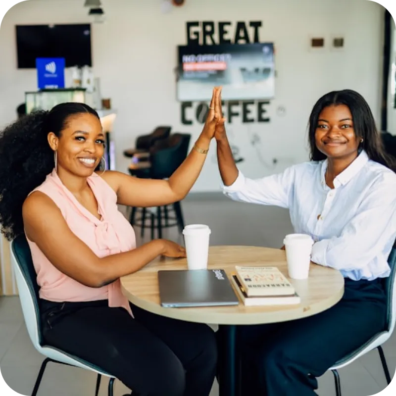 Two business partners high-fiving