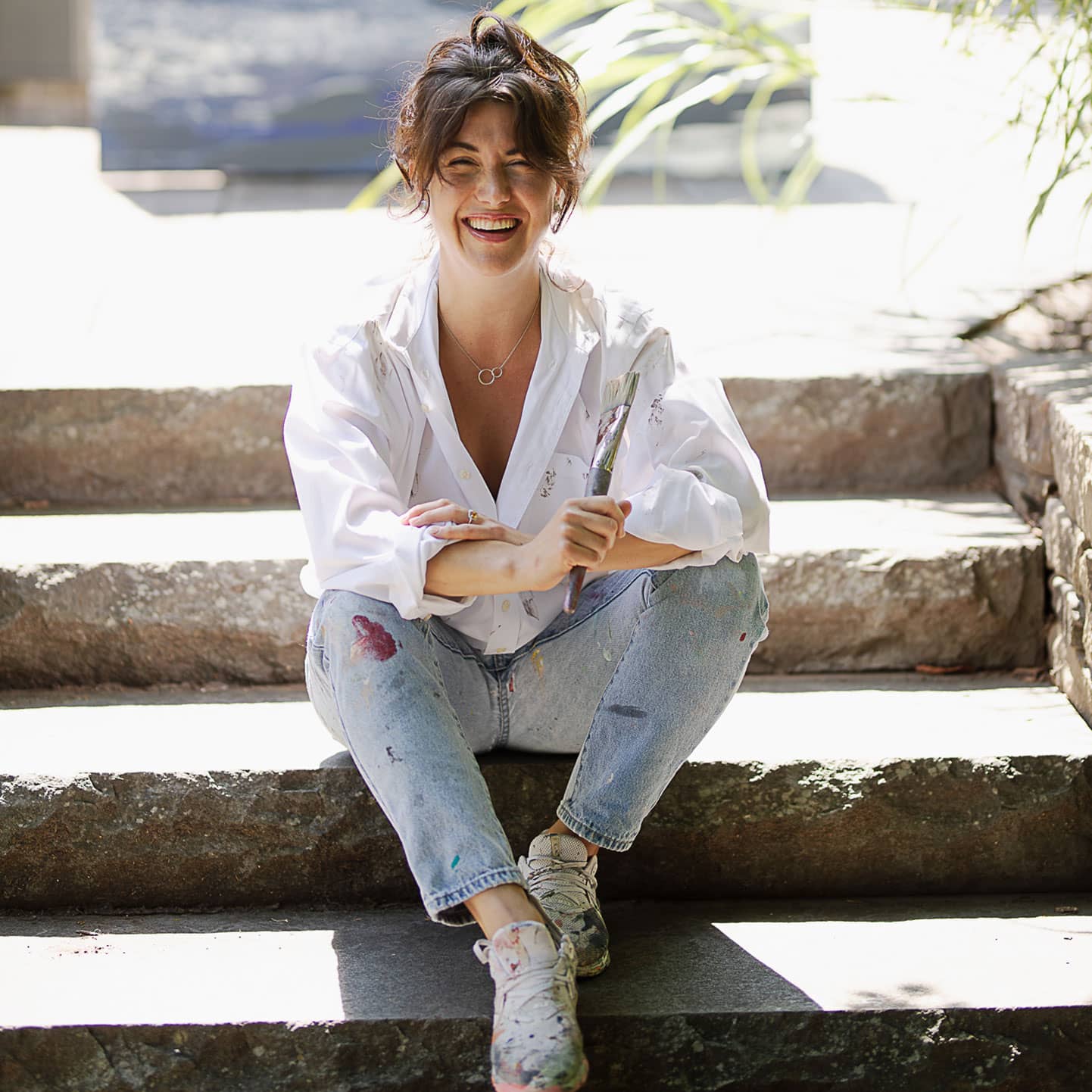 Claudie B sitting on the stairs