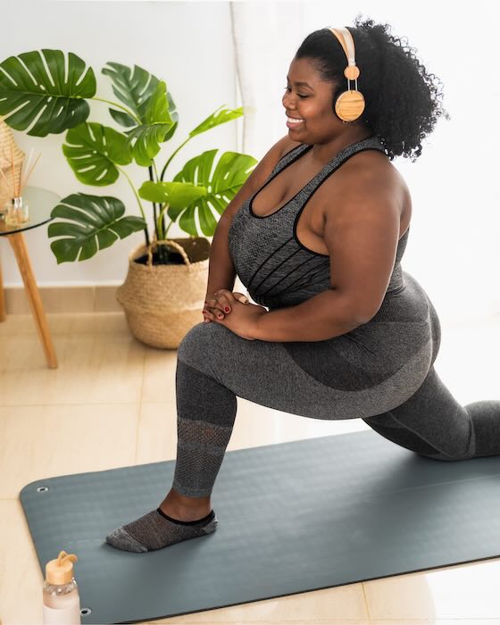 A woman stretching while doing exercise
