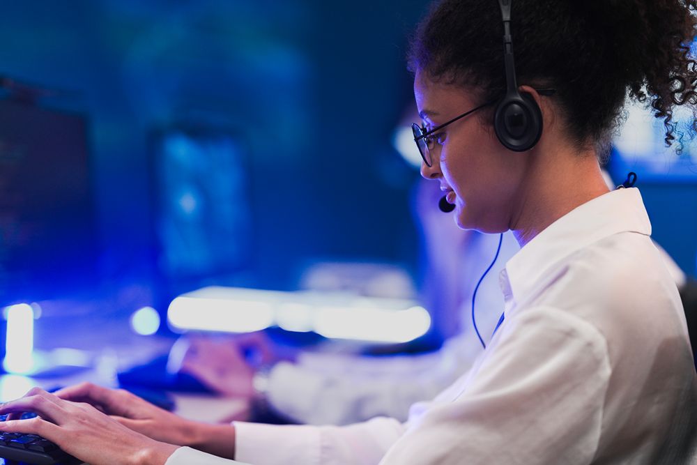 Security analyst monitoring controls to maintain continuous CMMC compliance