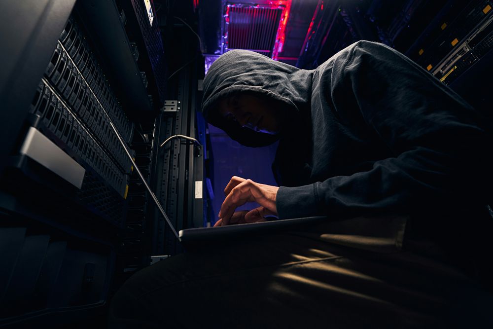 Analysts validating dark web monitoring alerts before escalation