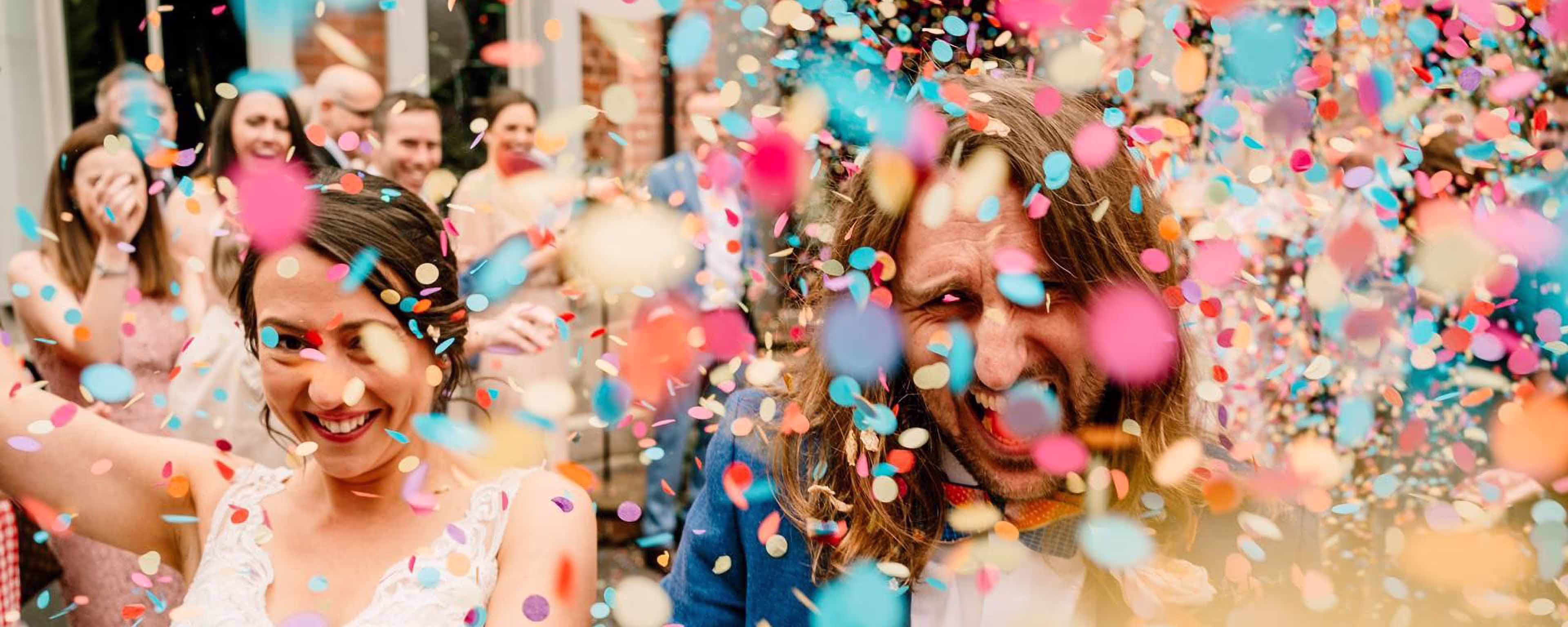Couple in confetti at the Faversham wedding venue