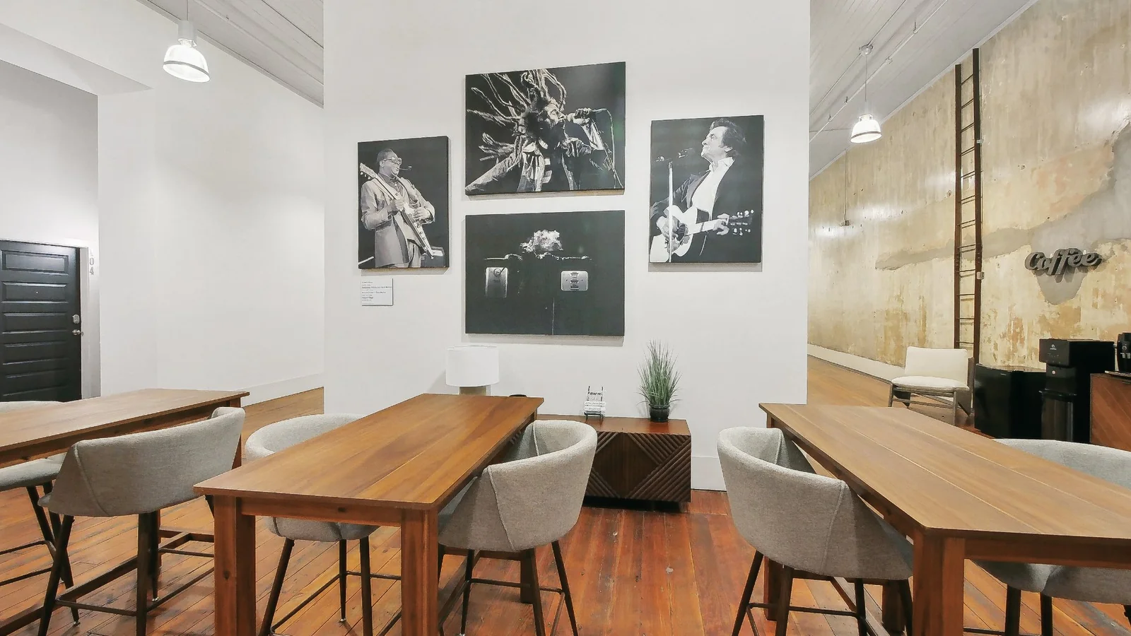 Coworking lounge with coffee bar and music at The Lamar Lofts
