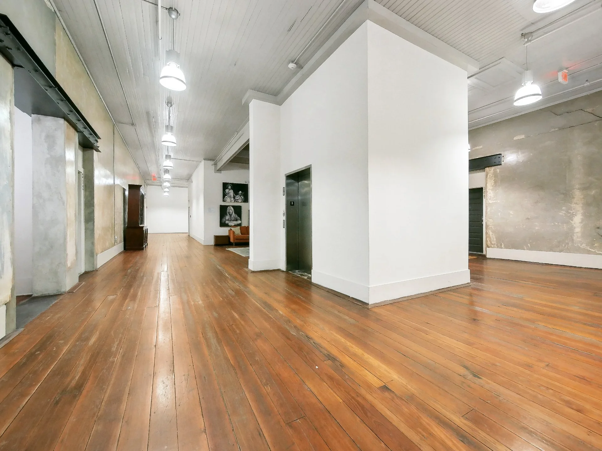 Historic white brick facade of The Lamar Lofts building