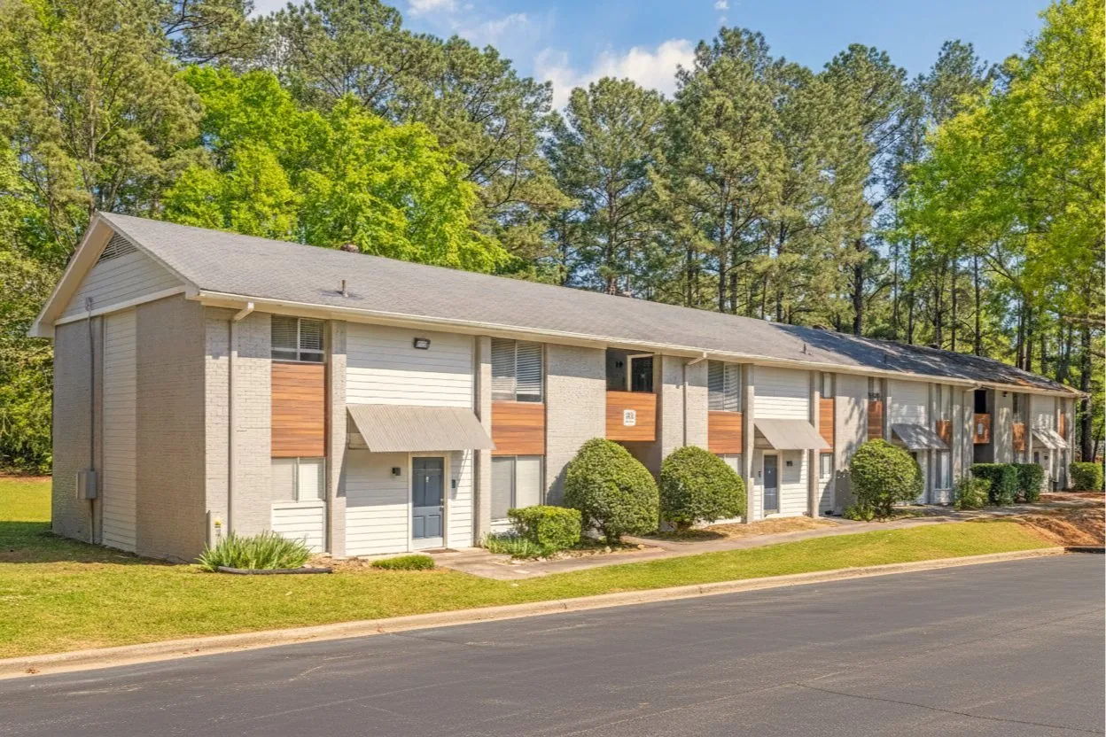 Exterior building front with summer trees at The Kenzie