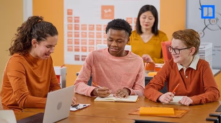 A blog thumbnail image featuring a group of diverse students actively collaborating on a classroom project, showcasing the hands-on and collaborative nature of project-based learning.