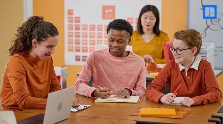 A blog thumbnail image featuring a group of diverse students actively collaborating on a classroom project, showcasing the hands-on and collaborative nature of project-based learning.