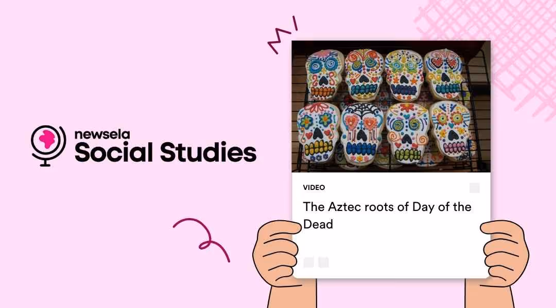 A Newsela Social Studies graphic with a video titled "The Aztec roots of Day of the Dead." The image shows a tray of brightly decorated sugar skull cookies on a cooling rack.