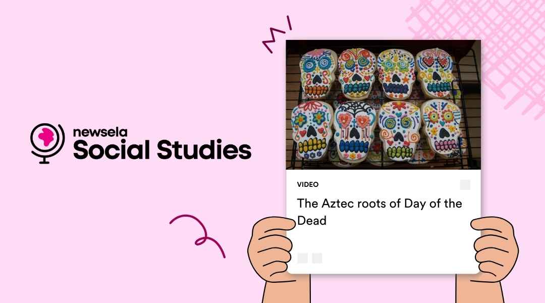 A Newsela Social Studies graphic with a video titled "The Aztec roots of Day of the Dead." The image shows a tray of brightly decorated sugar skull cookies on a cooling rack.