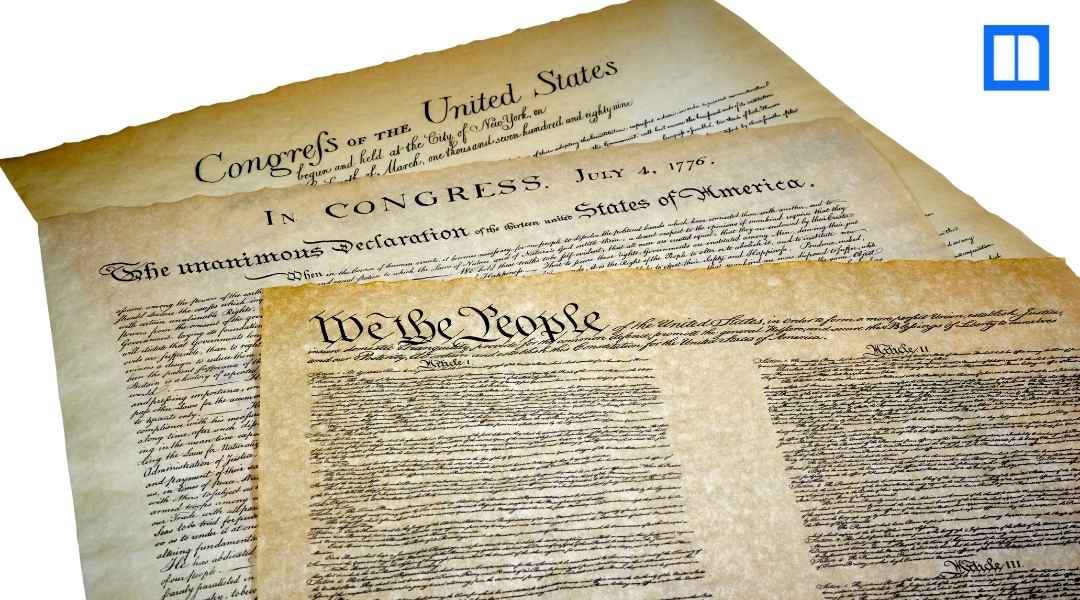 A layered view of historical U.S. documents, including the Declaration of Independence and the Constitution ("We the People").