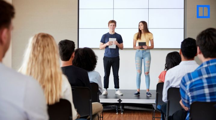 Students present to classmates during an ELA classroom activity, showing real-world learning through student discussion and communication.