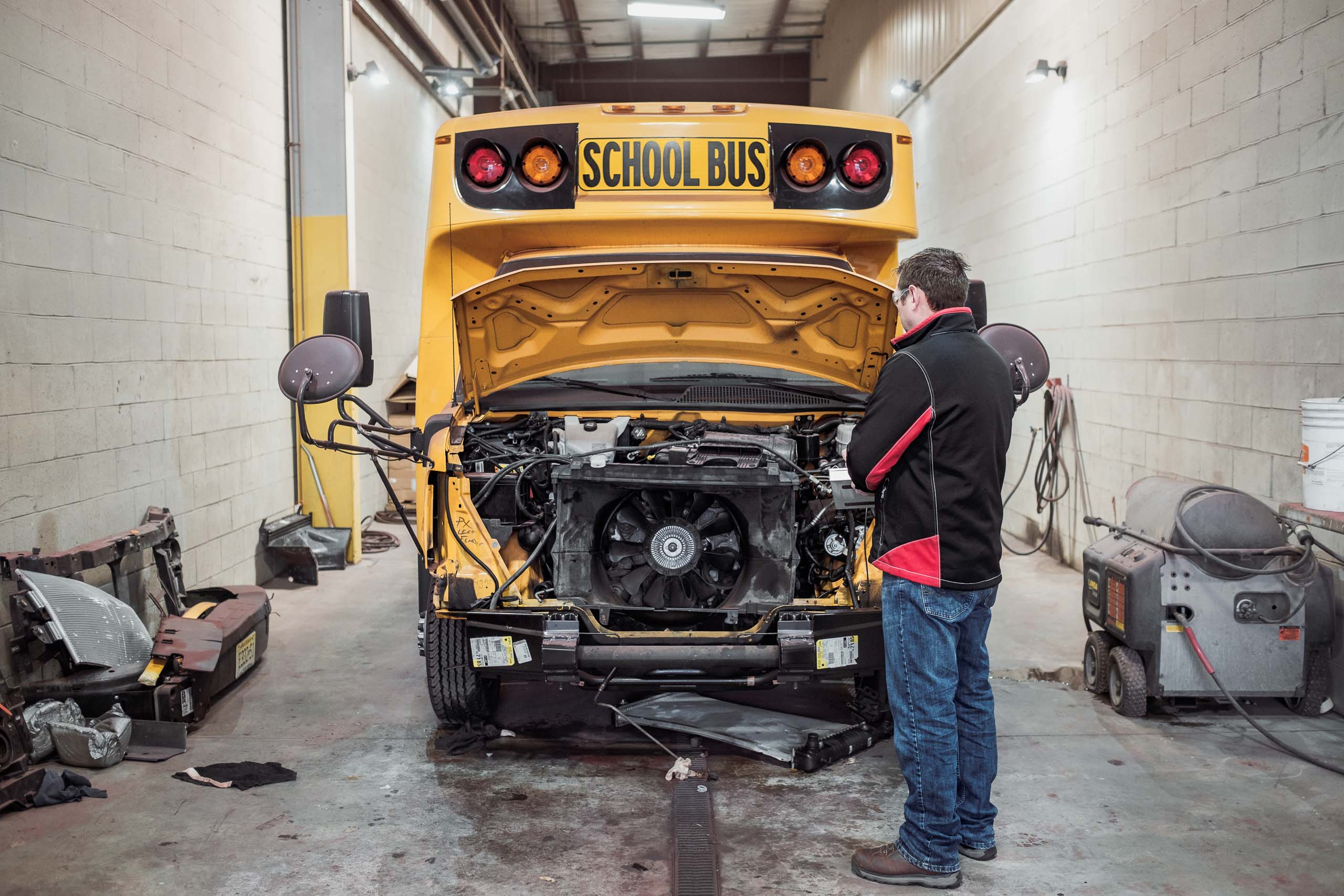 a school bus being repaired