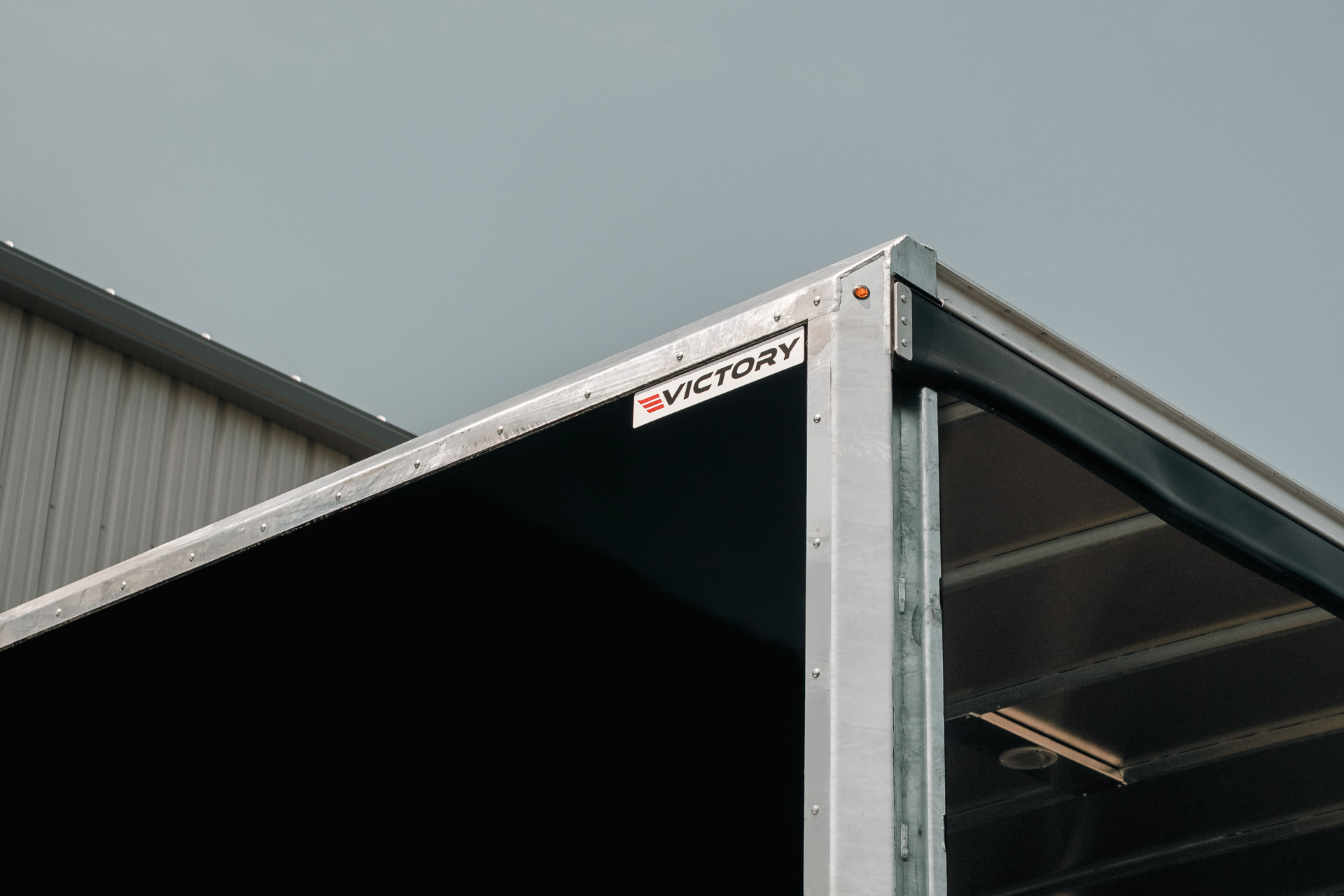 Close-up detail of the galvanized front frame and front wall of Victory's demo curtainside truck.