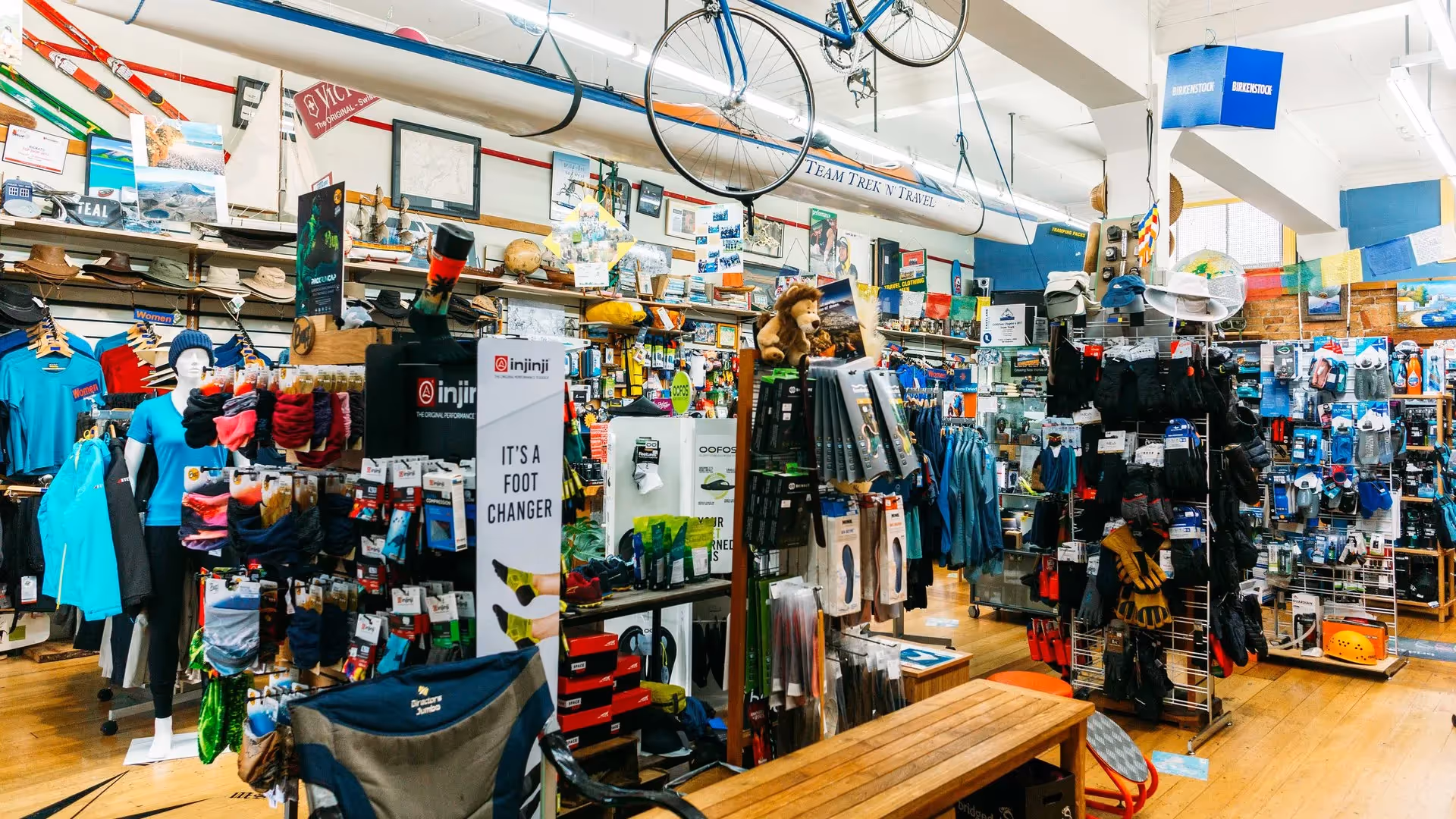 Alt text: Interior of a local outdoor equipment store in Hamilton, showcasing a variety of hiking gear, clothing, and accessories. The vibrant display promotes community engagement and supports local businesses in the heart of the city.