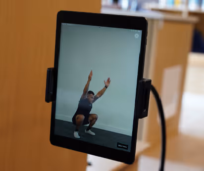 Tablet displaying movement analysis for fitness assessment at proof3 gym