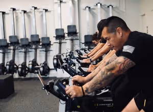 Group of members training on bikes