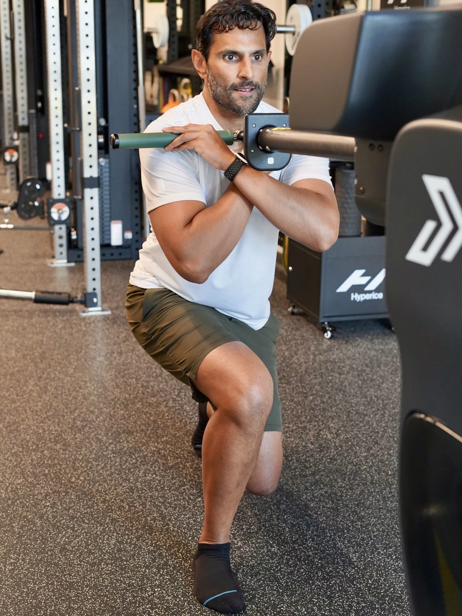 A member pressing the Proteus bar through a power test at proof3