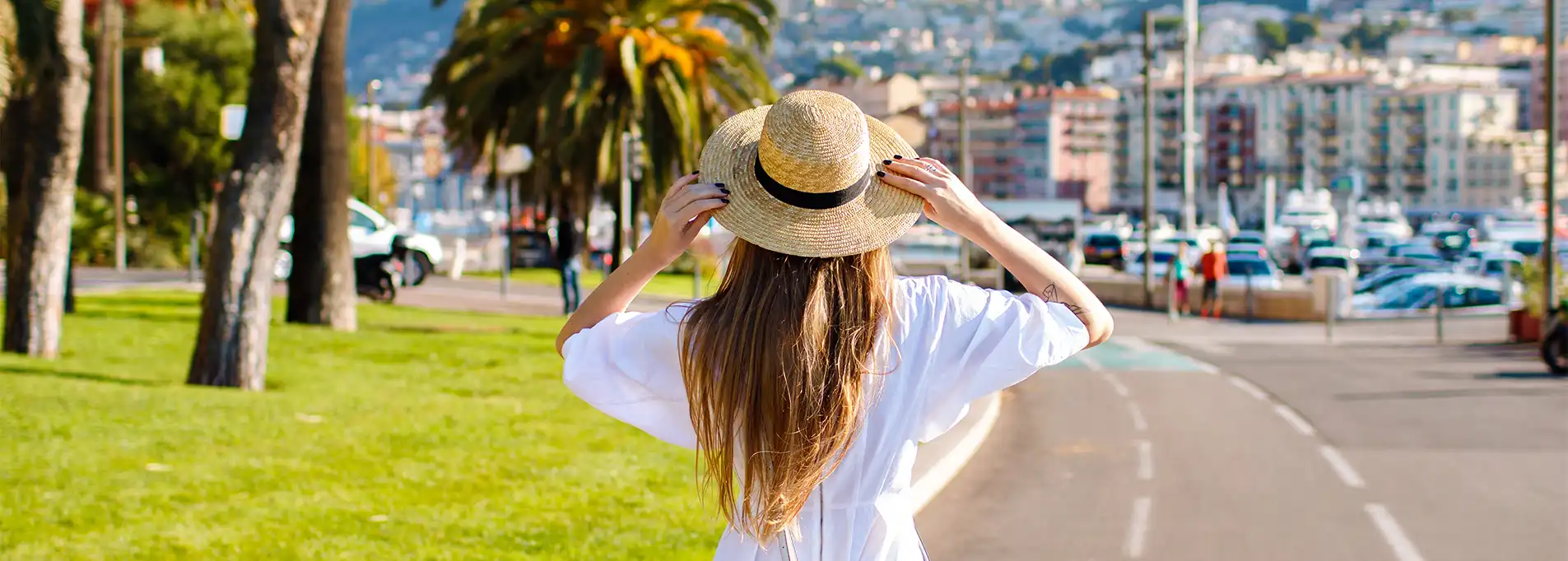 Woman enjoying a relaxing moment in Cannes near the LePoussin Hotel.