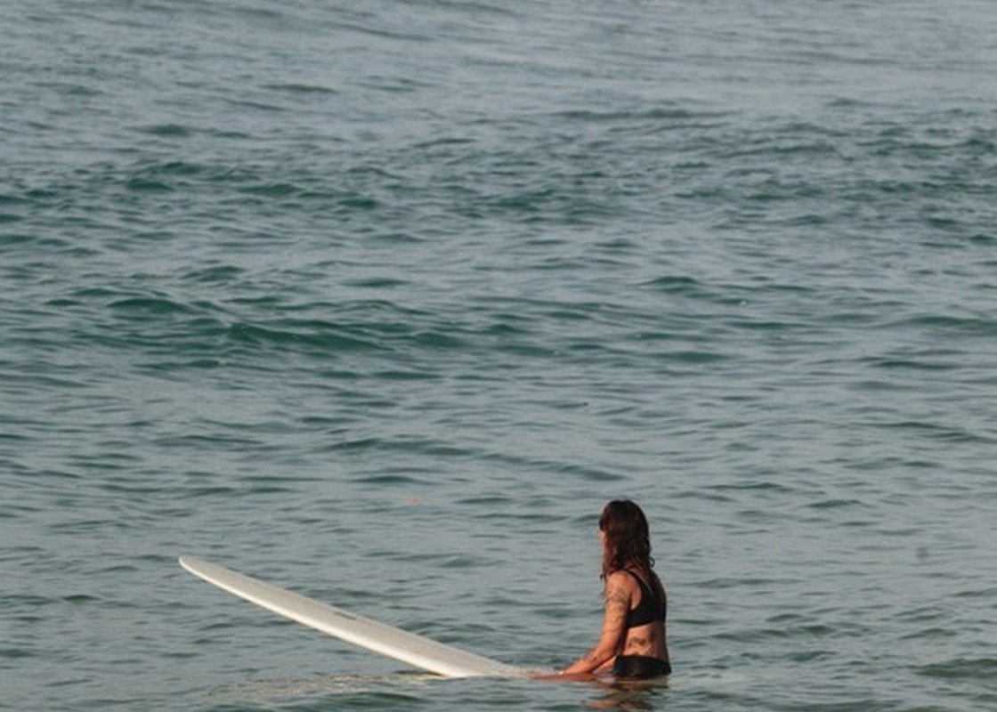 Surfer paddling out