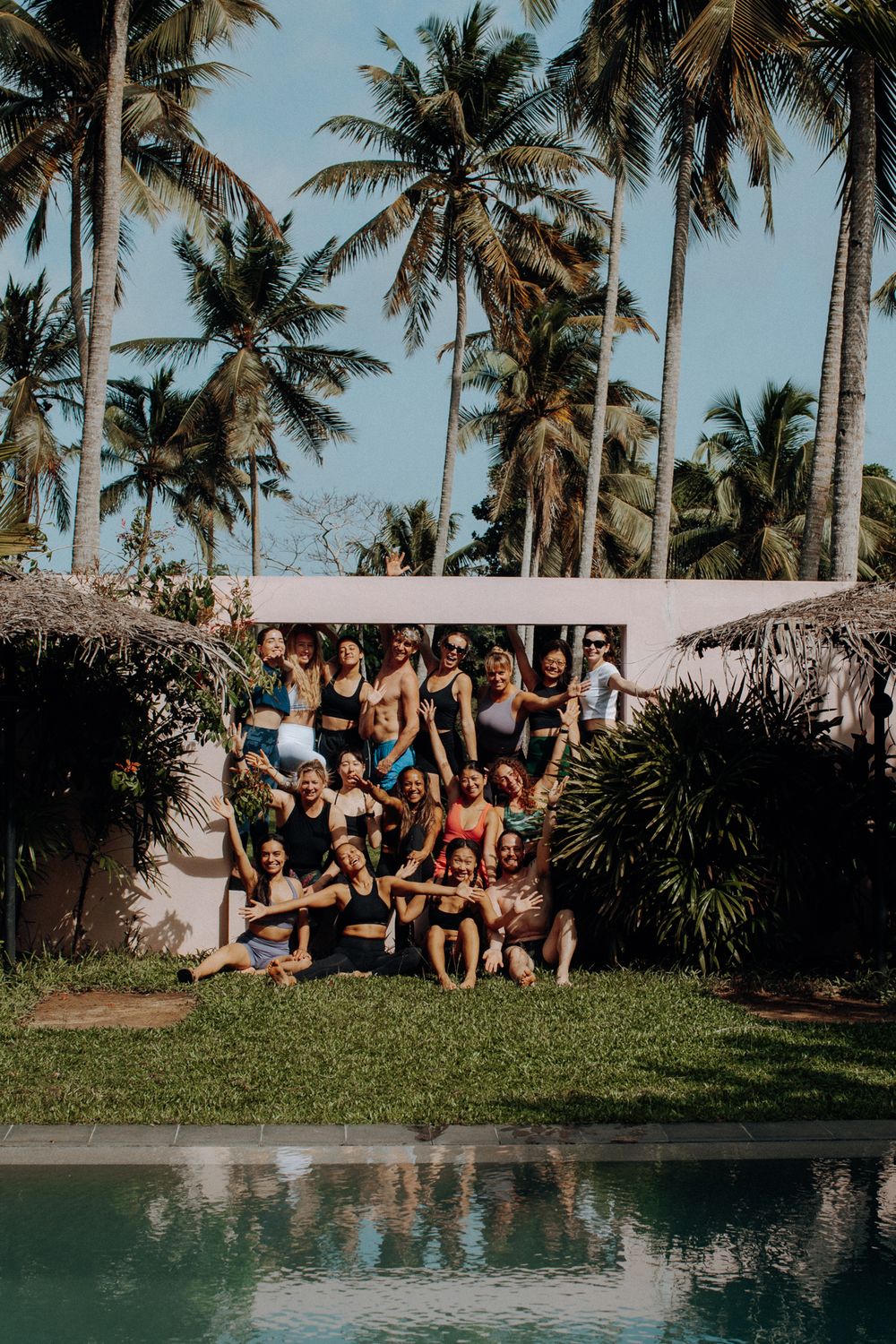 A retreat group together by the pool at PALM