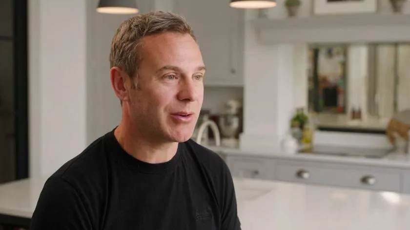 Interview frame: a client talks in his kitchen