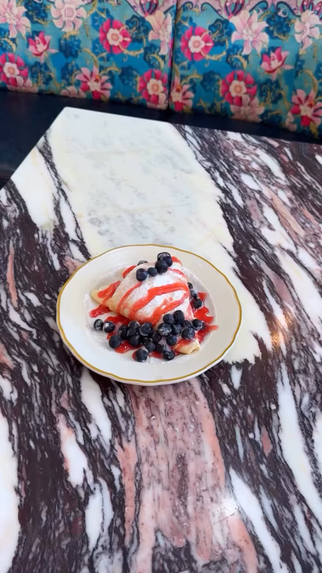 Celebrate the Paris Olympics with a bite of our Red, White & Bonjour Y’all crepe! Parisian flavor with a Creole twist! Made with sweetened Creole cream cheese, powdered sugar, strawberry coulis, & fresh blueberries.
