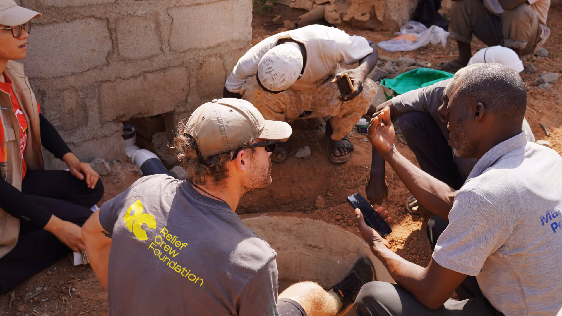 Relief Crew volunteer providing hands-on support to community of Zaazi, Ghana and building toilets