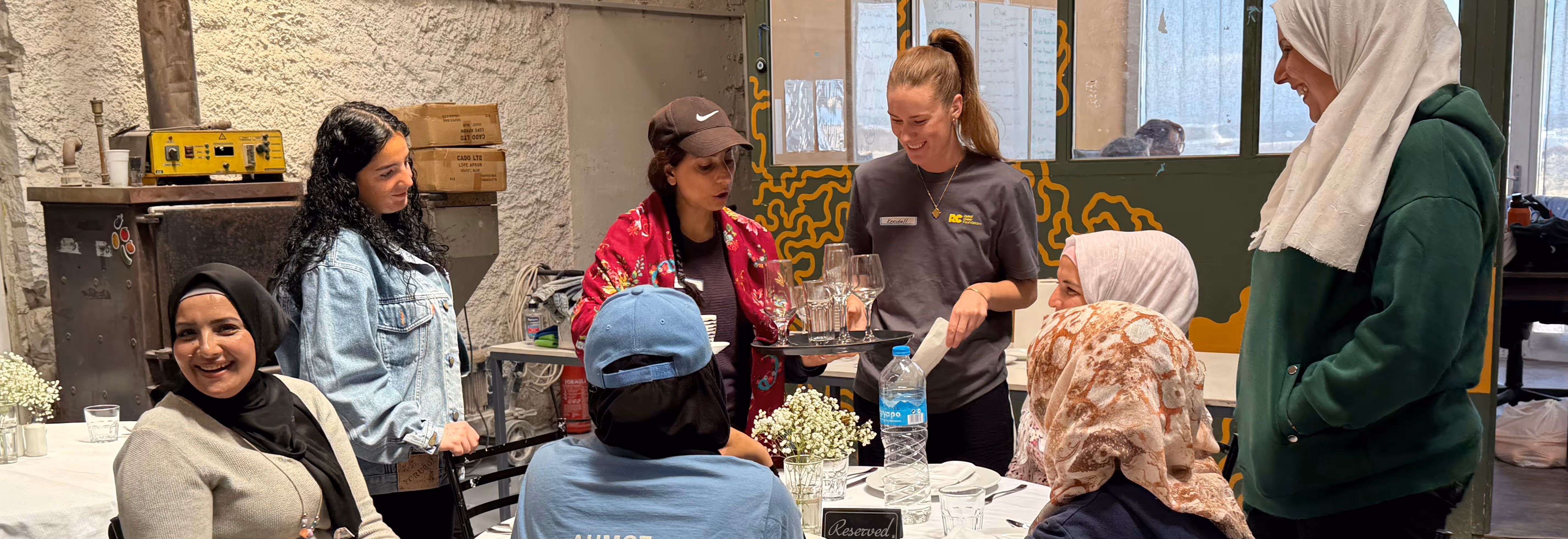 Relief Crew Volunteers offering hands on support to residents of a refugee camp, creating pathways to employment.