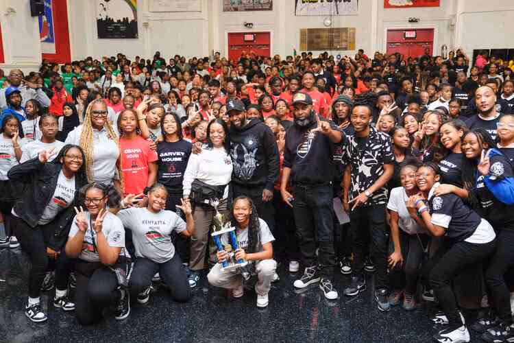 Students and staff with trophy