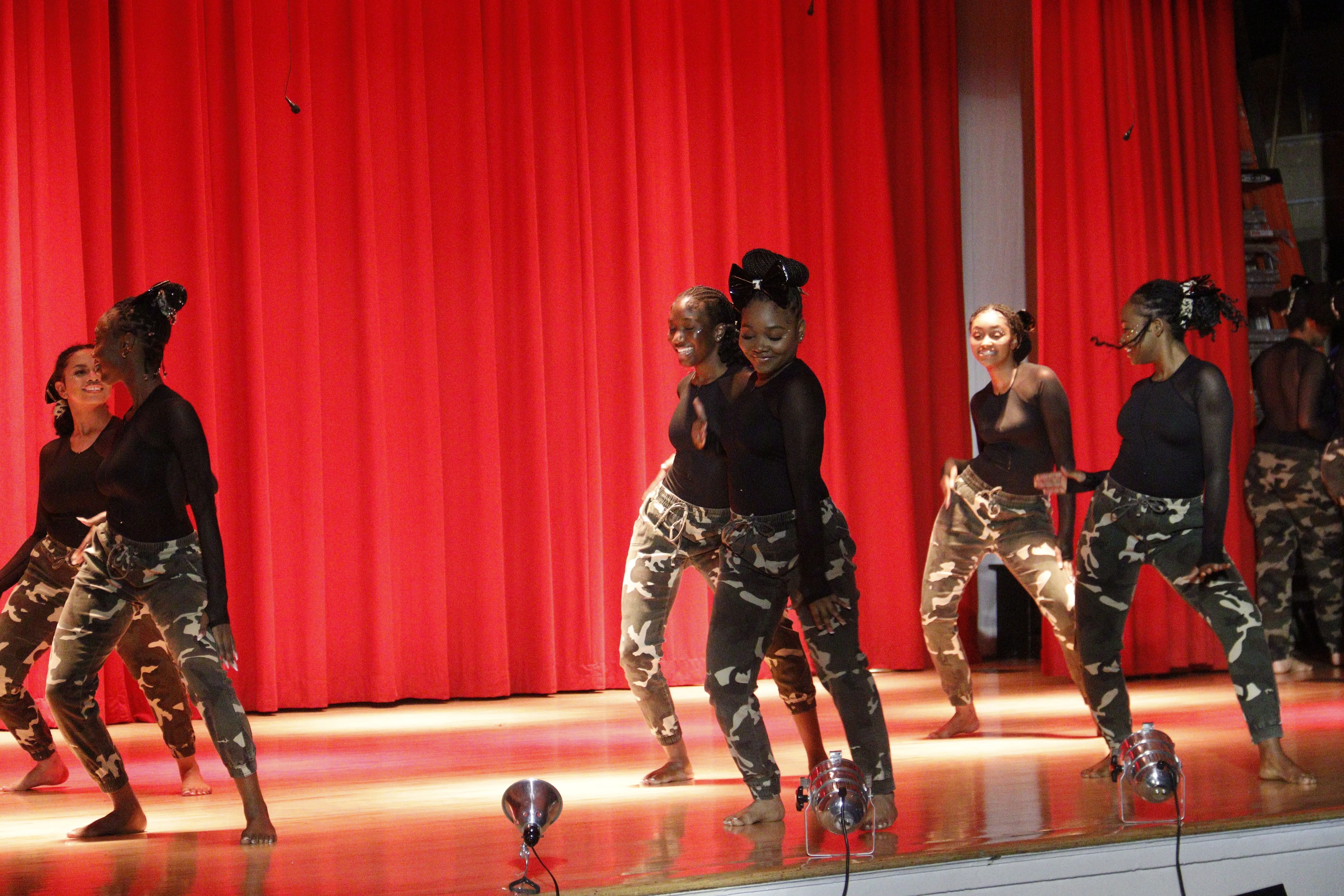 Students warming up near ballet barres