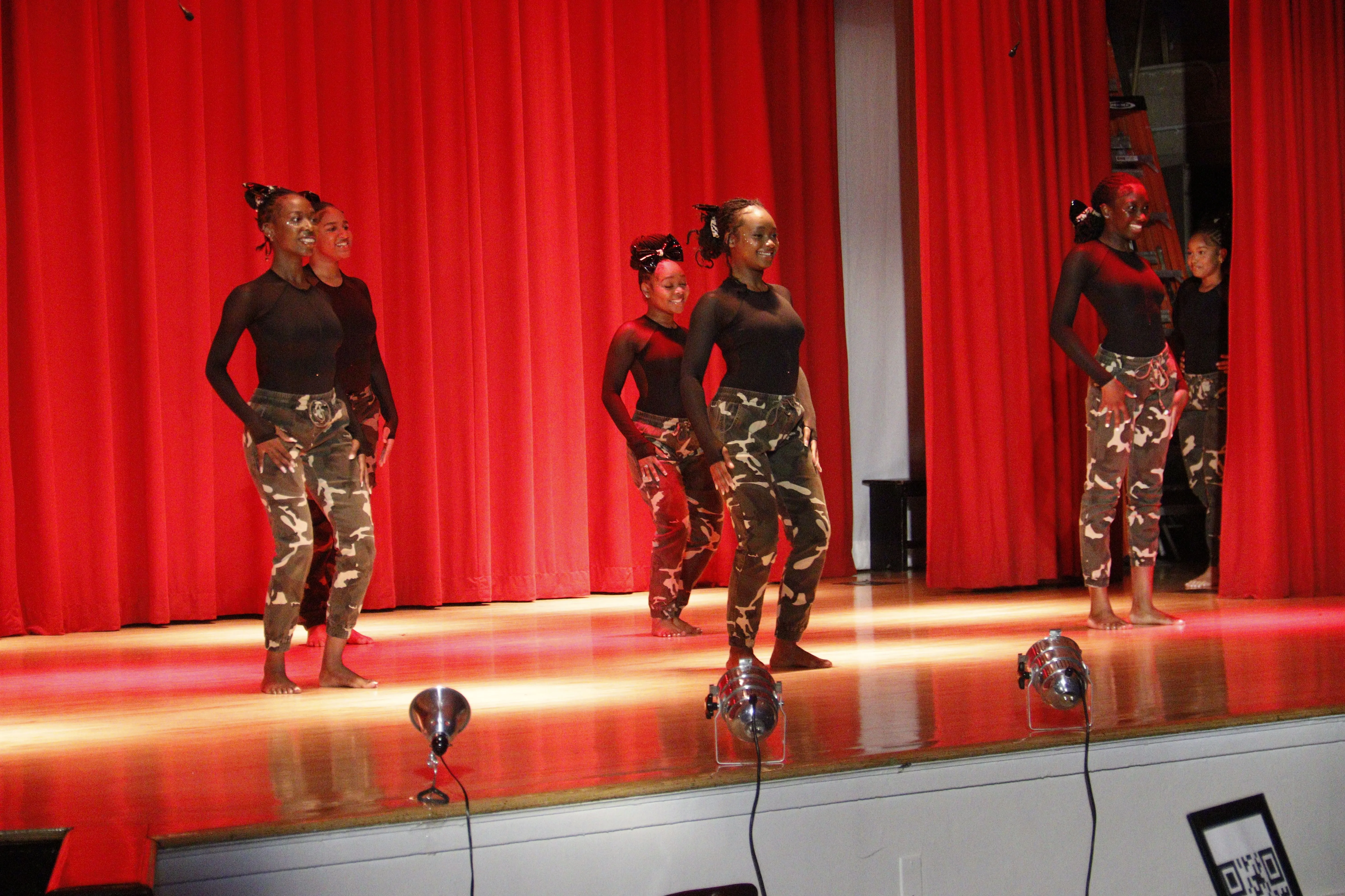 Group rehearsing on polished floor