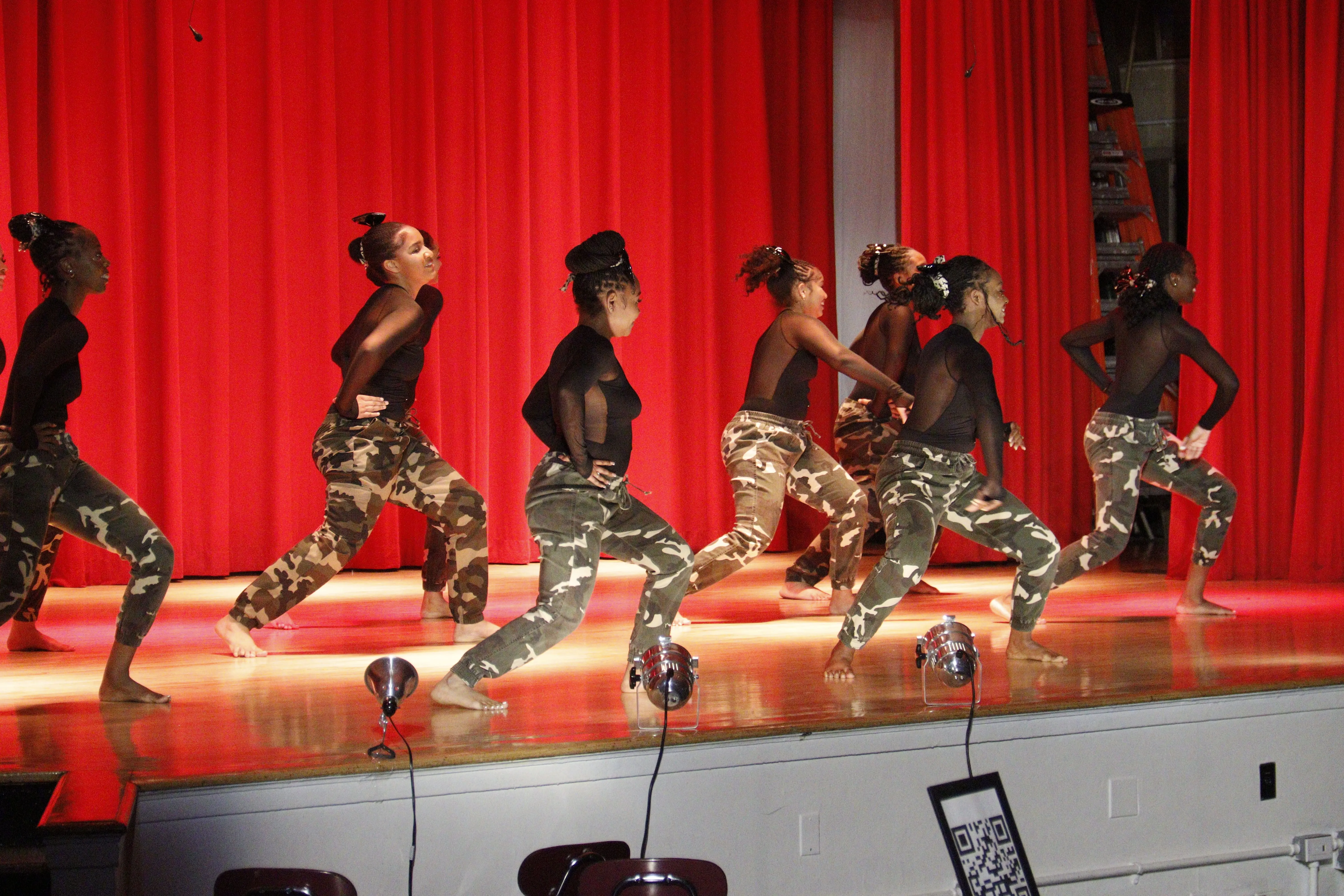 Dancers preparing in bright studio