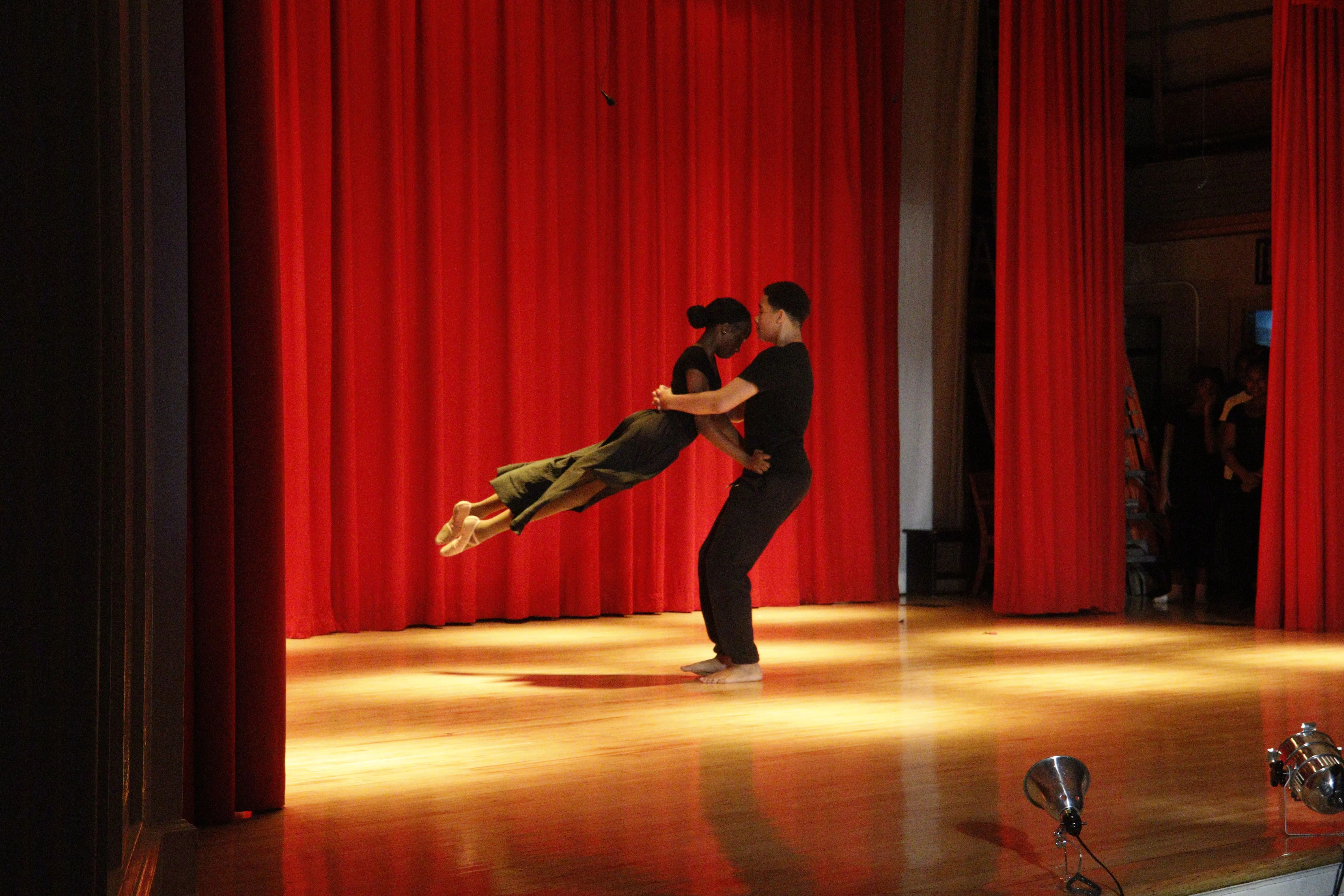 Principal Hendrickson in school auditorium