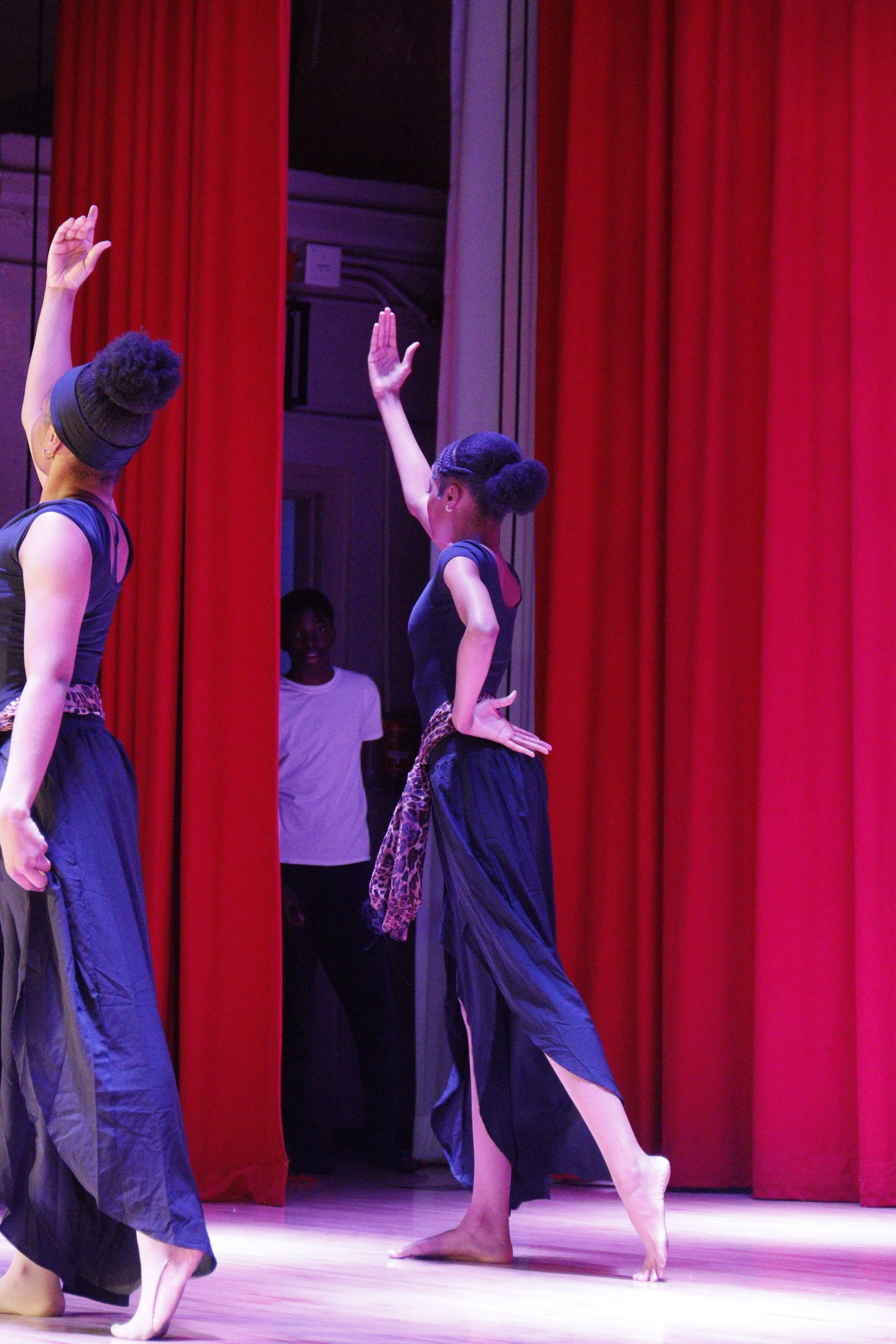 Instructor speaking on stage