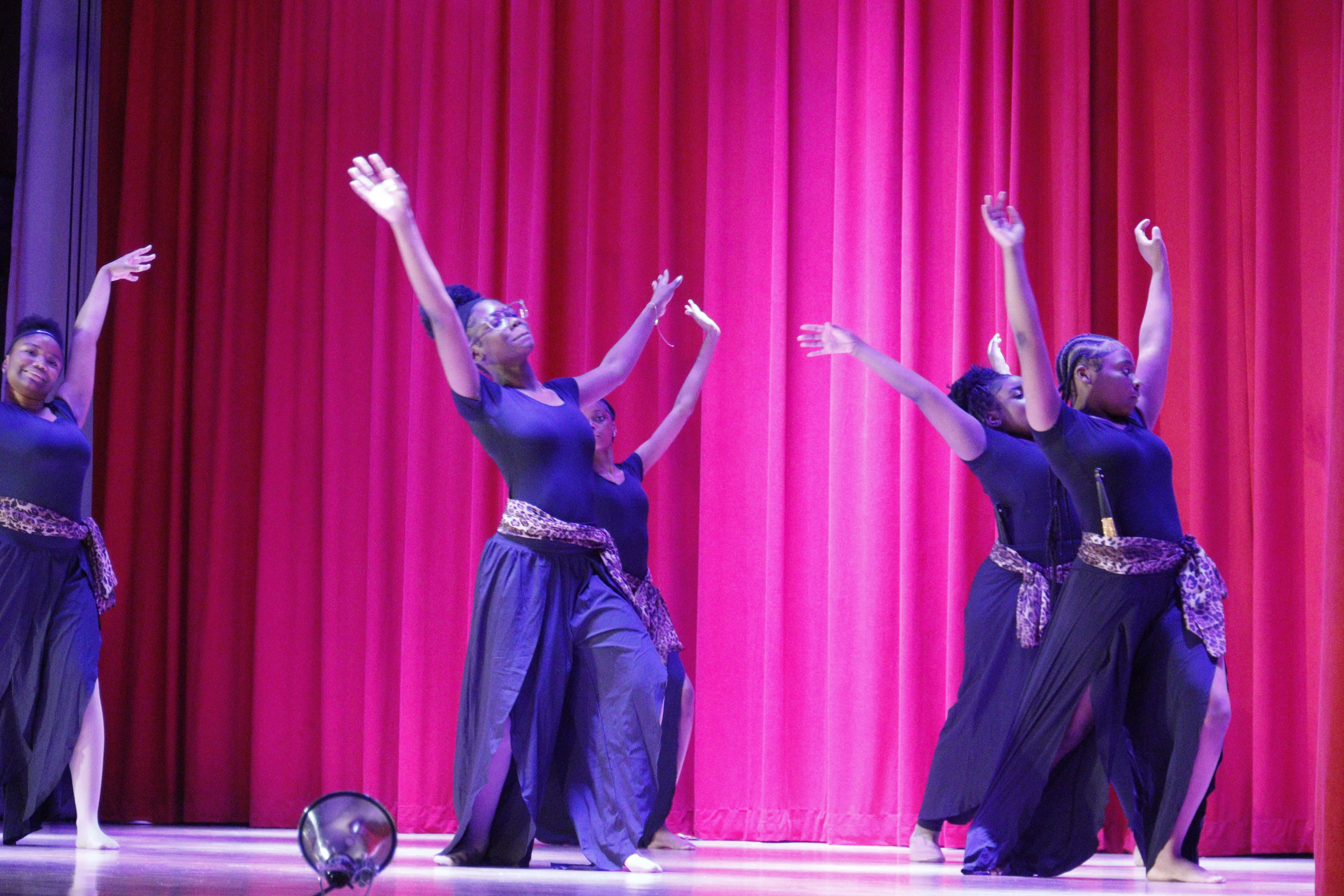 Group in black costumes