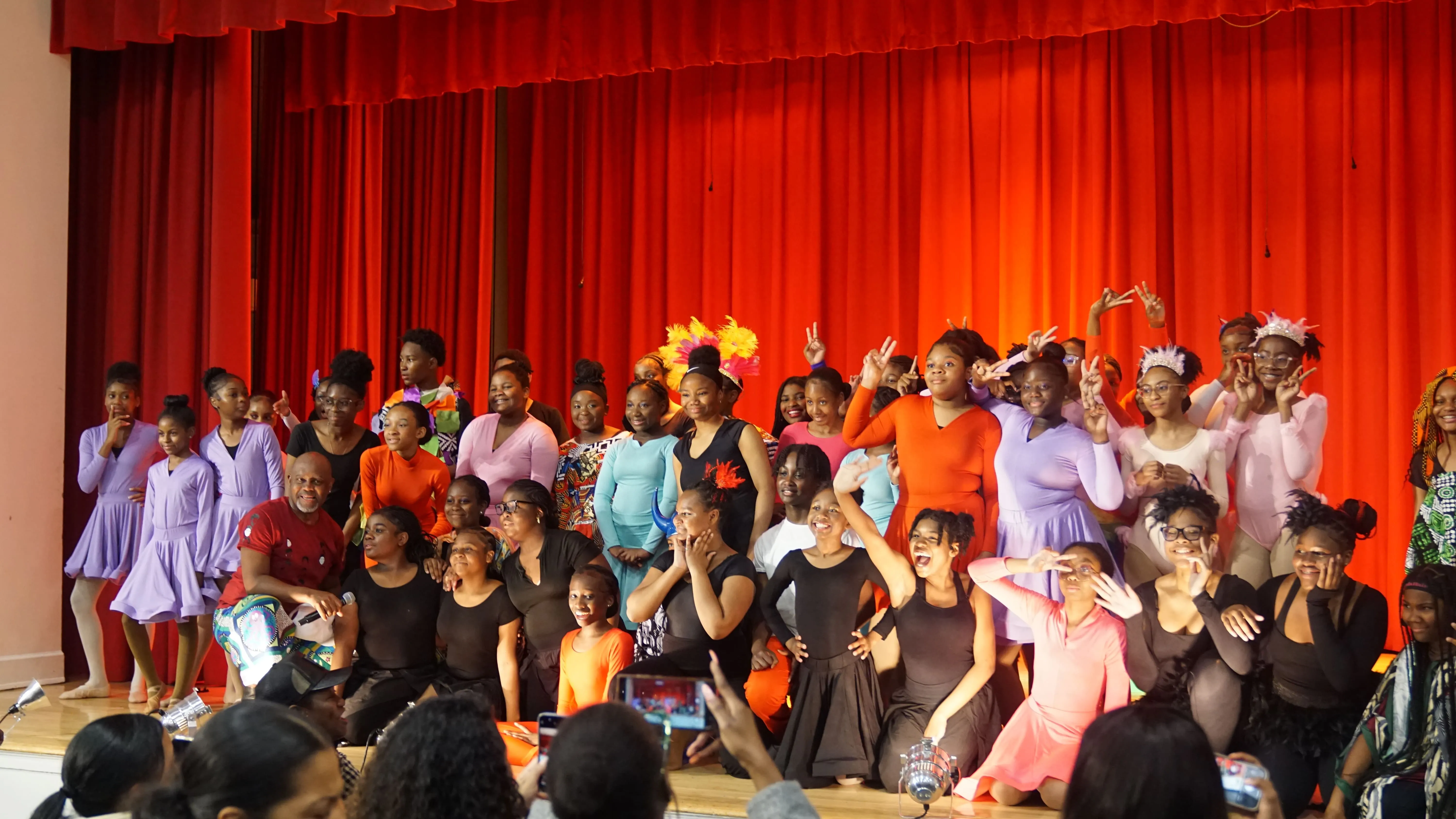 Principal Hendrickson in auditorium sweater