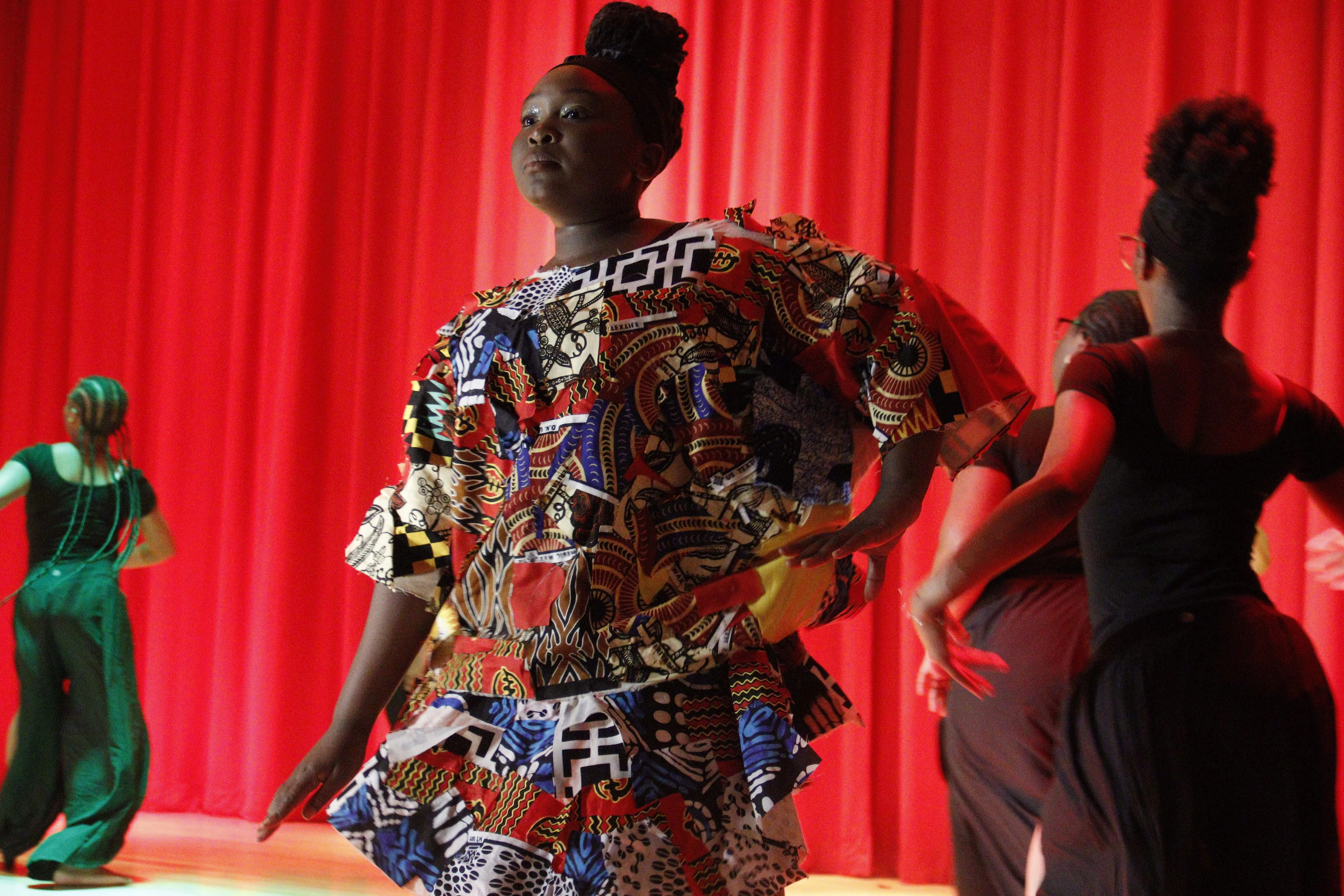 Principal Hendrickson in auditorium sweater