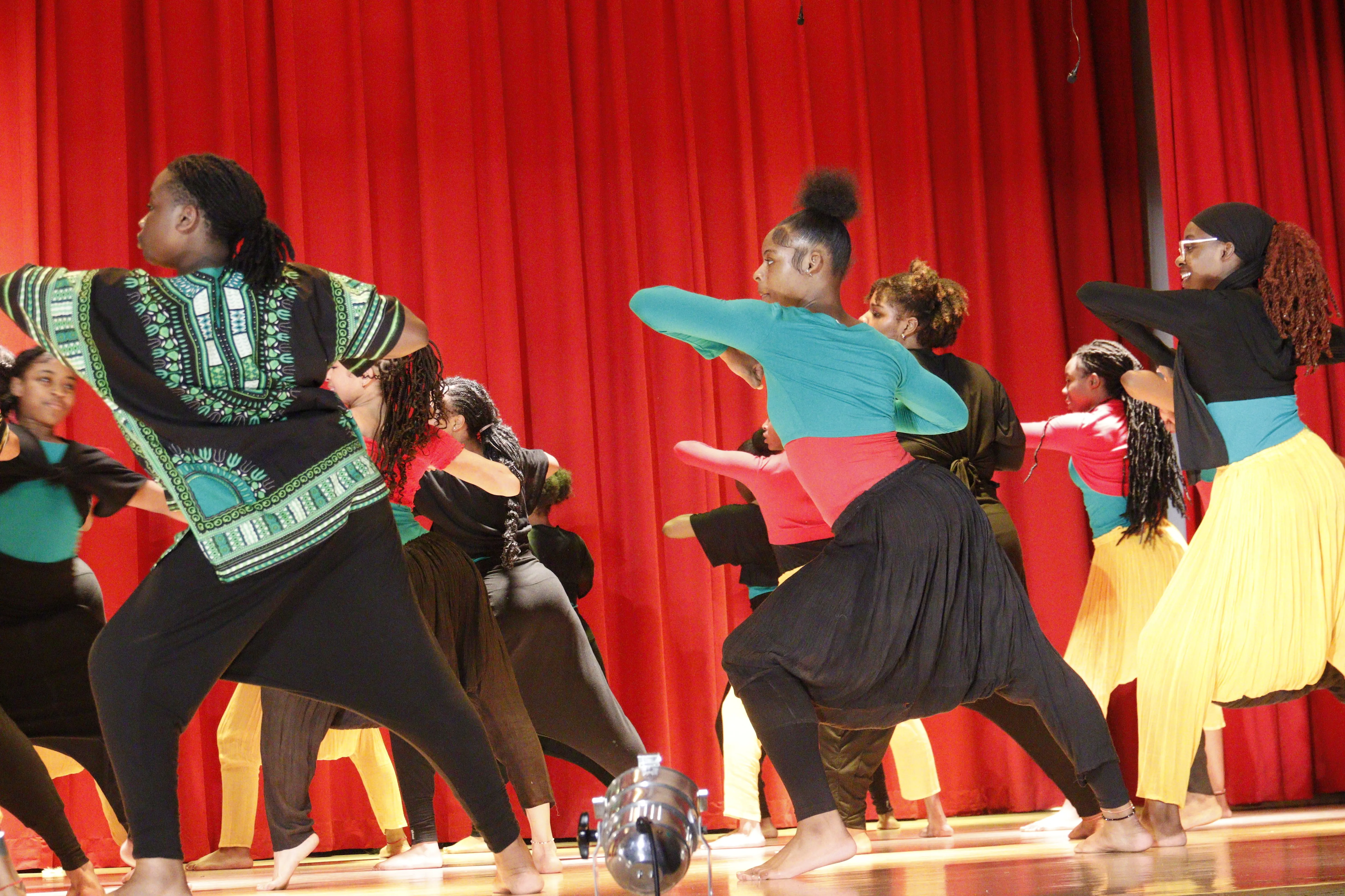 Performers in vibrant costumes