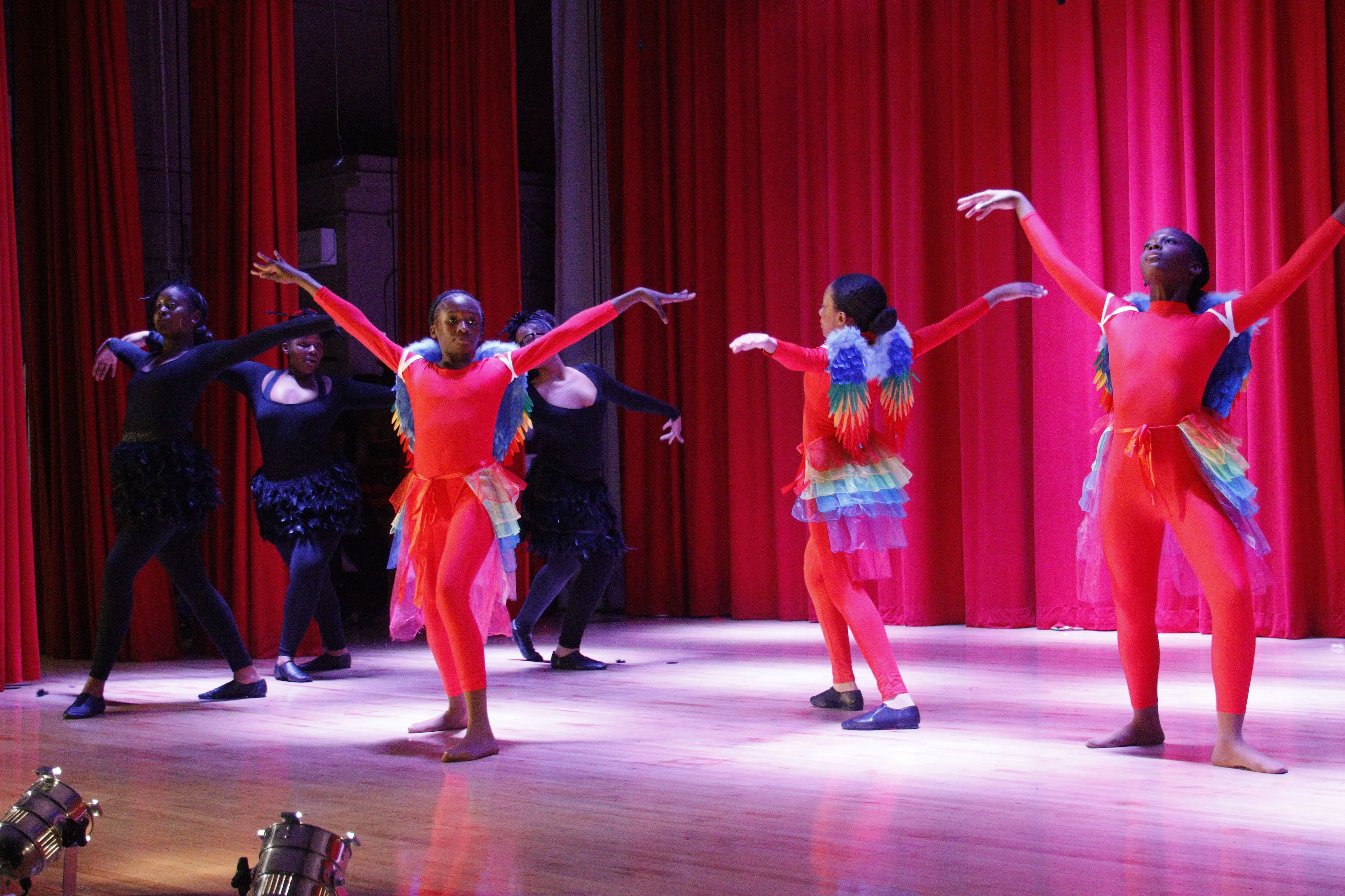 Group dancing in colorful outfits
