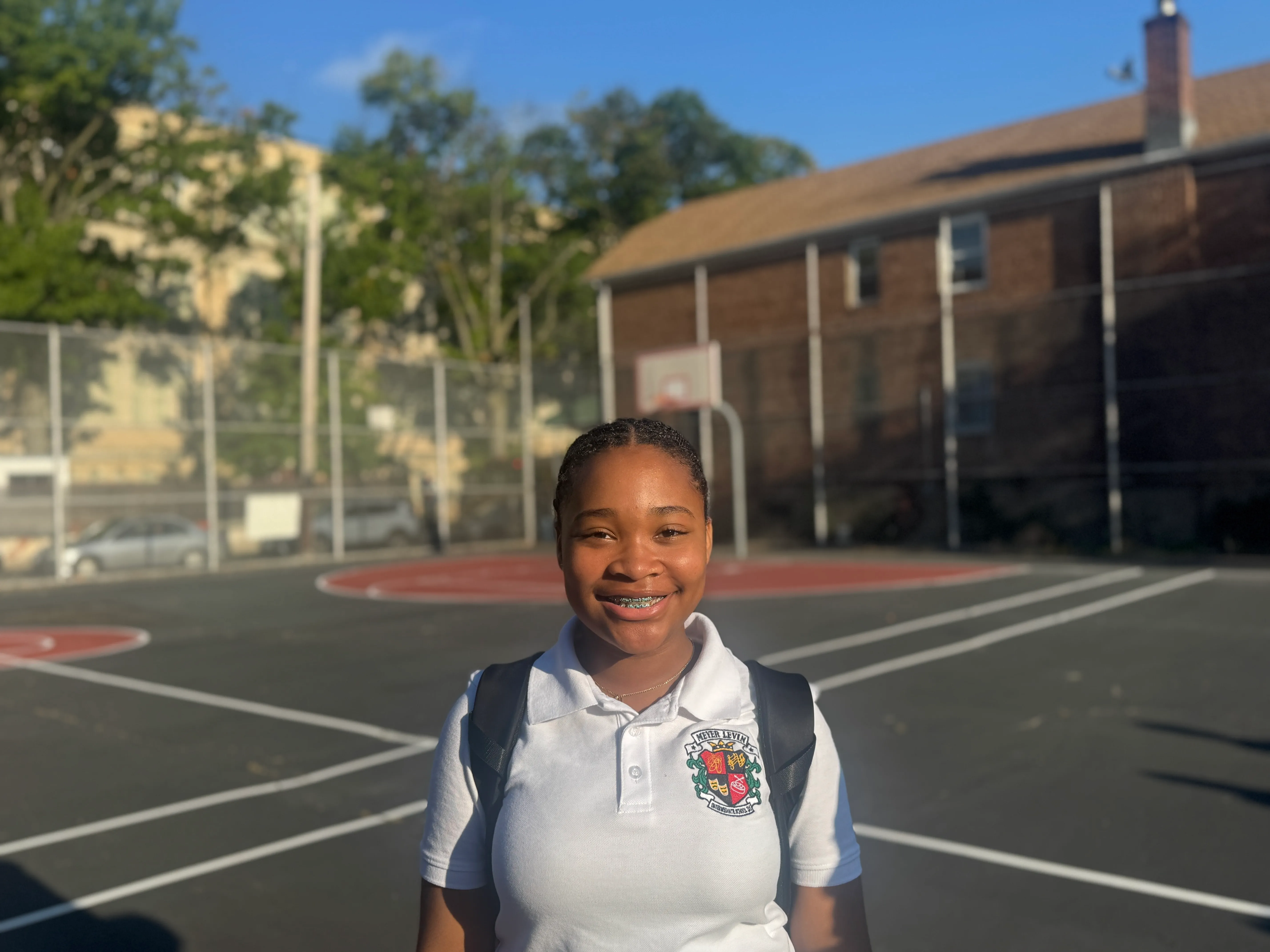 A girl stand in sports court