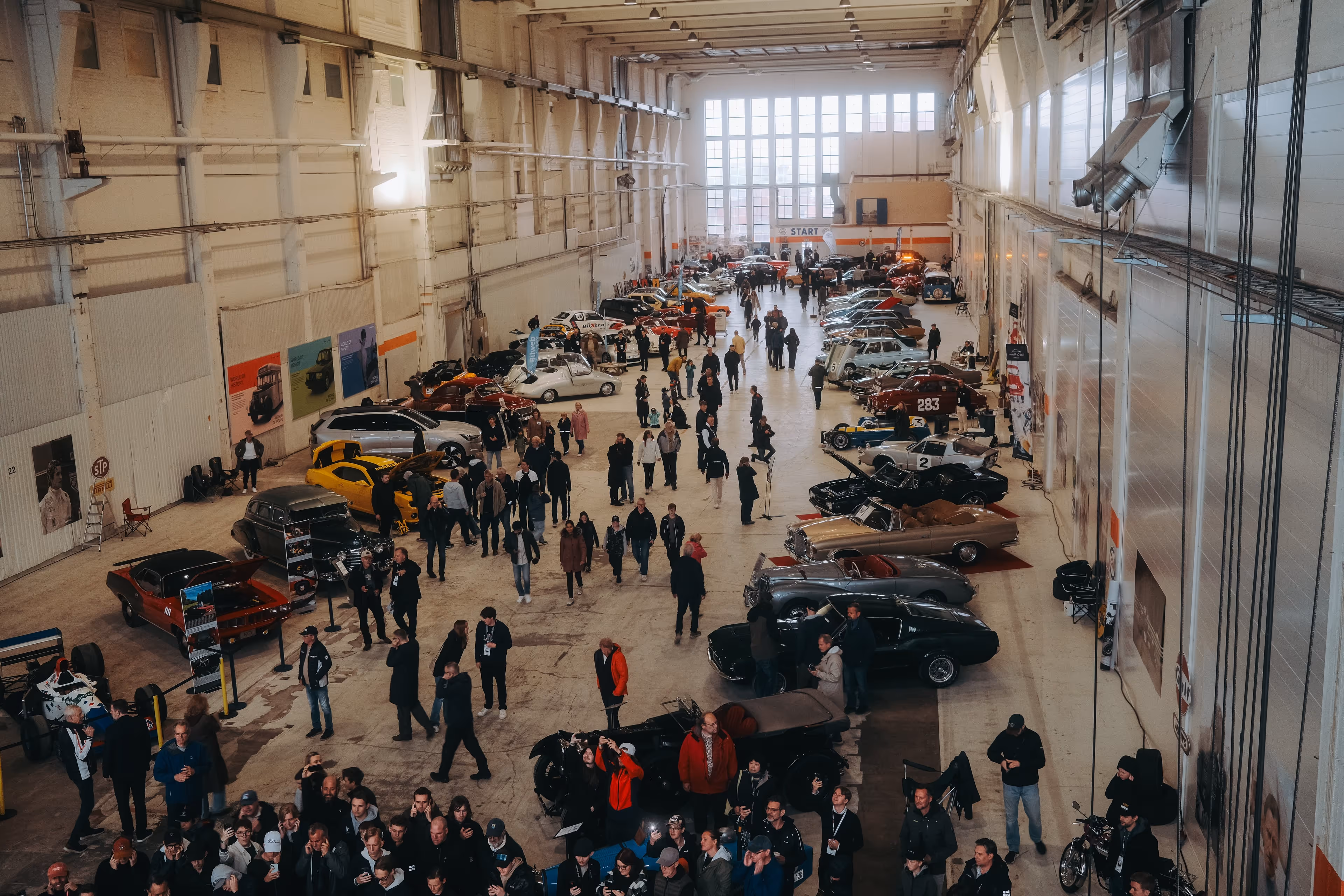 Two vehicles in a garage at gothenburg classic car weekend