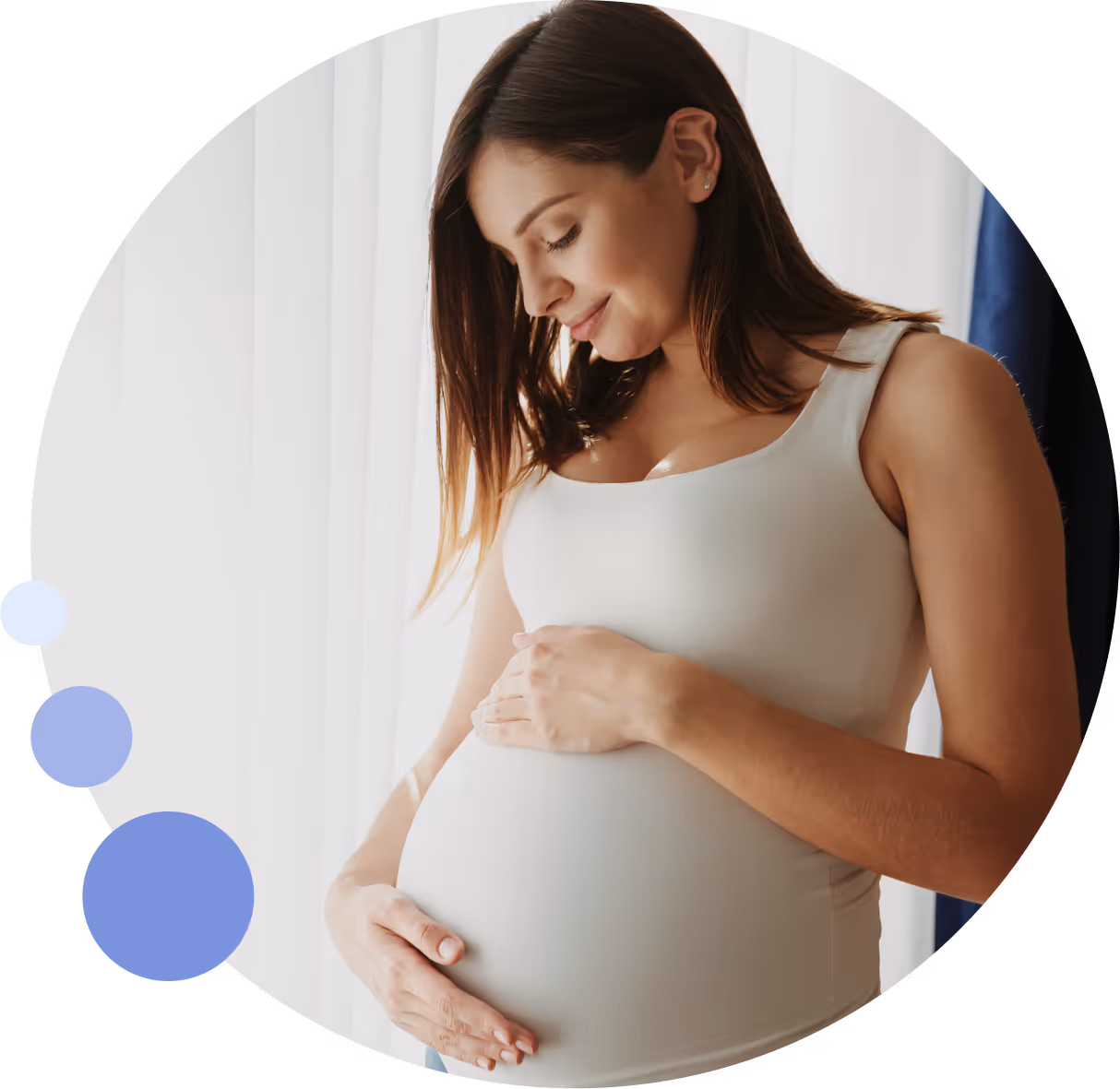Pregnant woman smiling and holding her belly, symbolizing family-building with EggFund fertility loans.