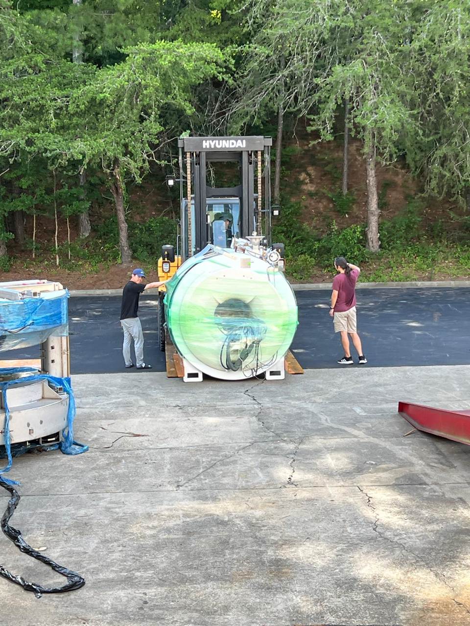 The wrapped GE magnet being unloaded at the Digit Systems warehouse.