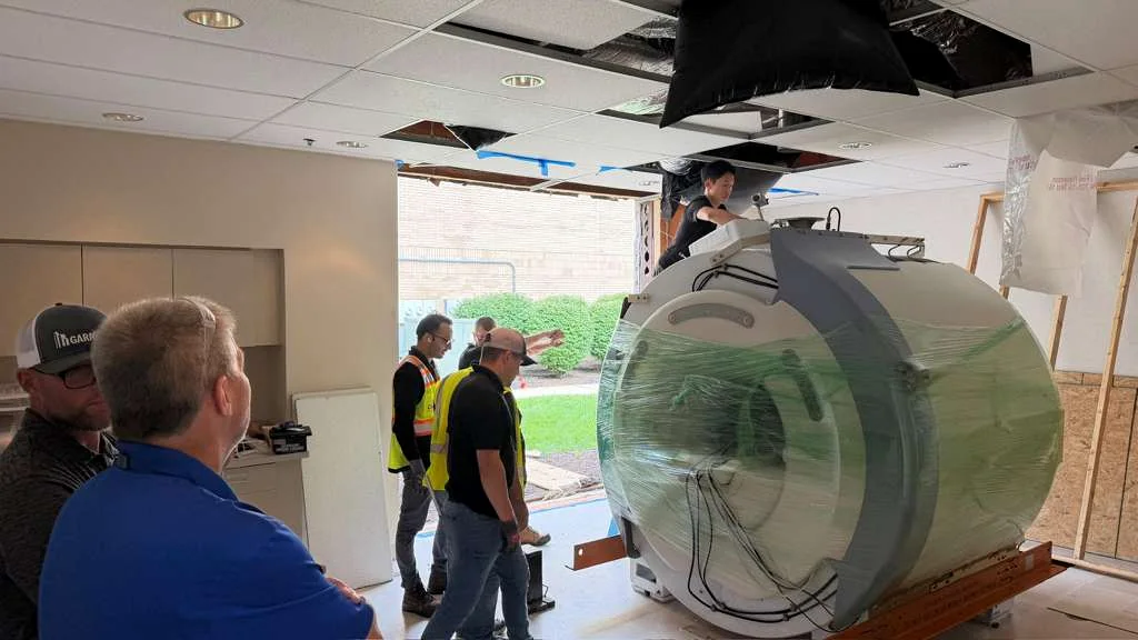 MRI magnet wrapped and prepared for rigging at the facility before transport.